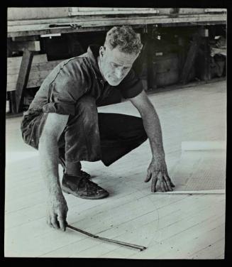 Billy Barnett lofing the lines of a yacht in his shed, probably in the 1960s.