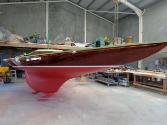 AEOLUS shows of its varnished topsides after a refinish.