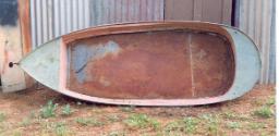 A corrugated iron/steel sheet metal dinghy complete with a water tank stern shape