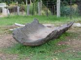 The red gum log boat, a hollowed out piece of red gum, the end planks that make the shape water…