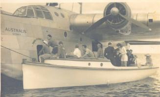 ALBATROSS ferrying passengers and cargo between a flying boat and the shore on Lord Howe Island…