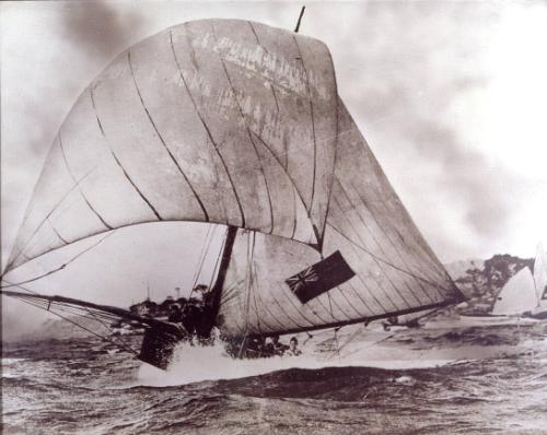BRITANNIA under spinnaker in a strong south east wind on Sydney Harbour during the1920s.
