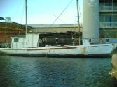 ANTONIA  in Townsville 2005, about to begin restoration by removing added deck superstructure.