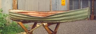 The corrugated iron dinghy before restoration to repair damage in the hull.