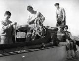 Aub Berryman and family aboard THERA at the SPYC mooring area, circa 1958-64.