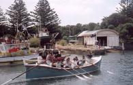 PORT FAIRY after being restored in 1996, and being rowed toward its slipway and shed upriver fr…