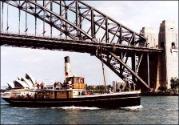 WARATAH heading up the Harbour under the Sydney Harbour Bridge.