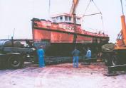 NABILLA being moved into position for restoration and display on land at the Axel Stenross Mari…