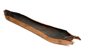 The Australian Museum's bark canoe from the Kempsey region. The folded ends with lashing are a …