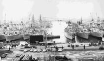 HMAS DIAMANTINA ( No 266) in port at Sambewang Dockyard Singapore in 1975 with other naval vess…
