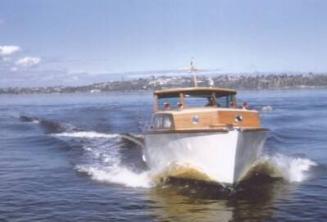 BINGARRA shows off its speed on a calm day on the Swan River in the late 1950s.