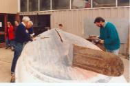 Annual maintenance on the hull. Note the shallow depth of the hull and very low aspect ratio ru…