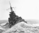 HMAS VAMPIRE at full speed turns to starboard and heels to port in this dramatic image from abo…