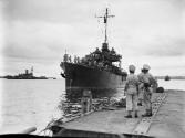 HMAS DIAMANTINA coming alongside the wharf at Torokina with the Japanese surrender party aboard…