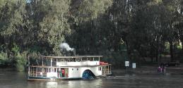 CANBERRA leaves a jetty on the Murray River in 2005, the large rudder is turning the paddlestea…