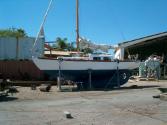 GALATEA-M out of the water for maintenance and showing its classic long keel profile.