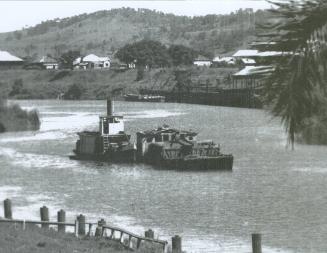 FLORRIE pushing a sand barge on the Richmond River.
