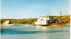 OSCAR W towing its barge DART up the Murray River, date unknown