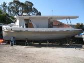WAWERA out of the water for repainting, the area below the main sponson is the original hull pr…