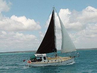 SOLACE II under sail in 2008. The additional shelter is one of the few changes to its appearenc…
