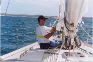 Vinny Lauwers at the mast.  This shows one of the modifications he made. The gooseneck connecti…