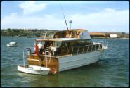 STELLA-S , a flying bridge cruiser around 12 metres long probably from around the 1950s
