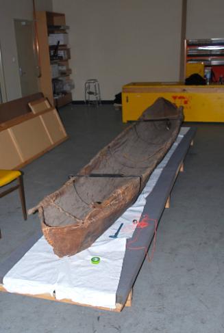 The canoe has almost parallel sides throughout its length