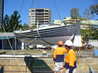 Motor Whaler 2717 being moved aboard HMAS DIAMANTINA in 2010 at the Queensland Maritime Museum