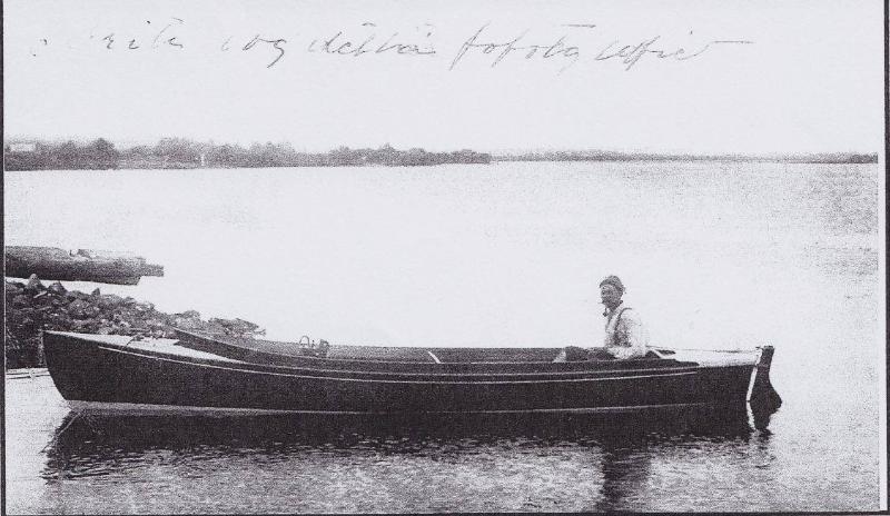 Gronfors at the tiller of ILMA JEAN which he built.