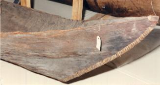 A close view of the expertly sewn ends of the canoe